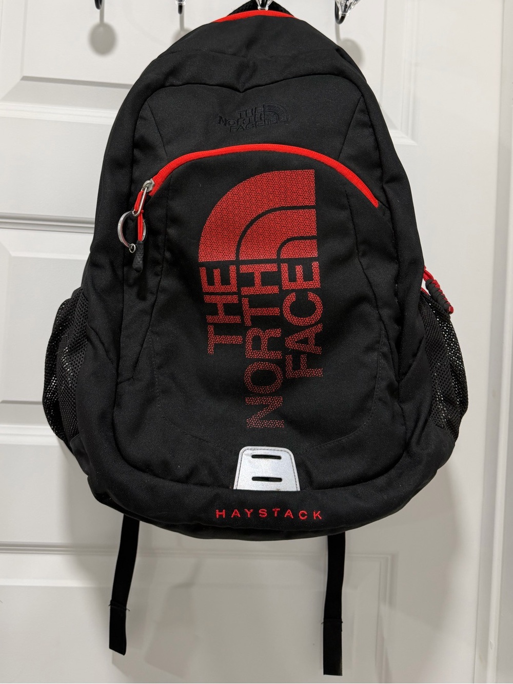 The North Face Haystack Backpack Vertical logo Black and Red
